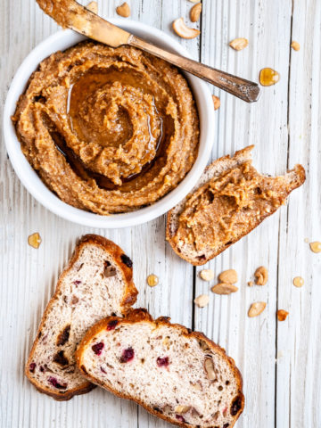 cashew date butter in bowl with bread