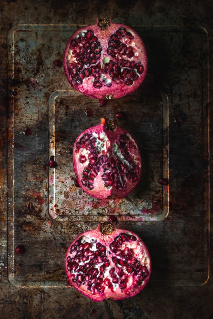3 pomegranate halves in a row