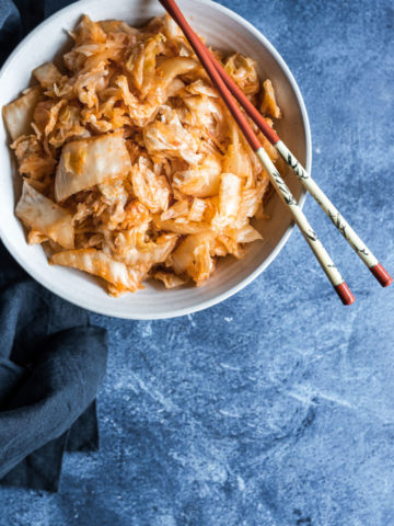 bowl of kimchi on blue background