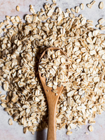wooden spoon over a pile of oats