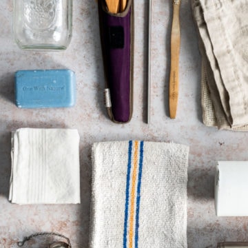tools for going zero waste - reusable utensils, bar soap, bamboo toothbrush, jar, towel