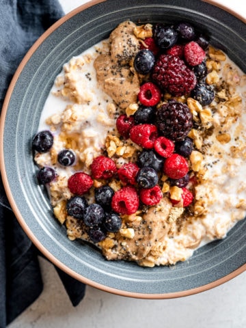 oatmeal with berries in a blue bowl
