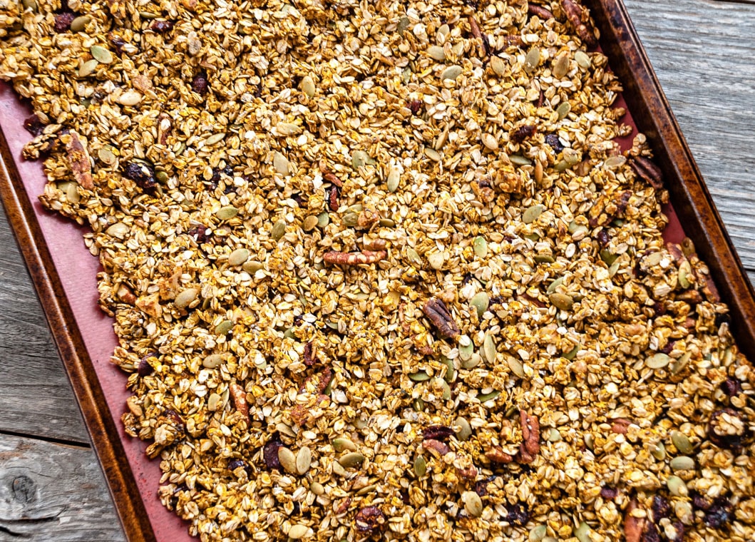 pumpkin nut granola on baking sheet