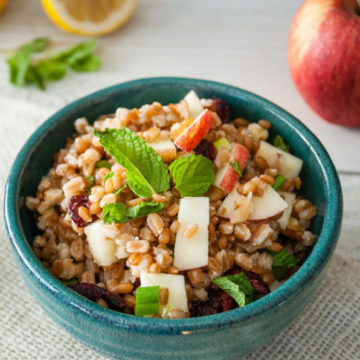 wheat berry salad in a blue bowl