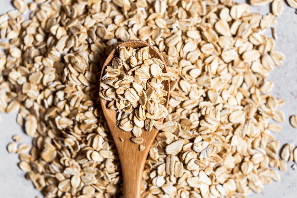 oats in spoon whole grains