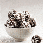chocolate coconut energy balls in small bowl