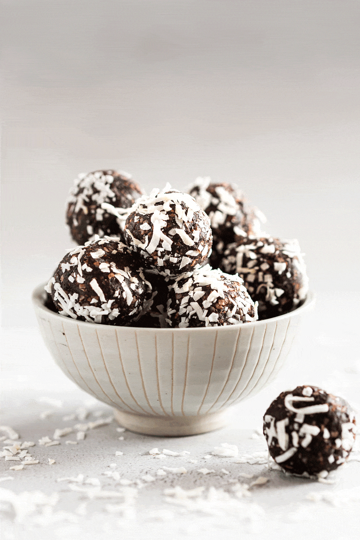 chocolate coconut energy balls in small bowl