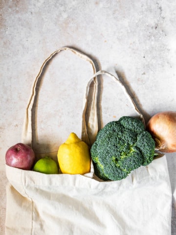 produce sticking out of canvas grocery bag