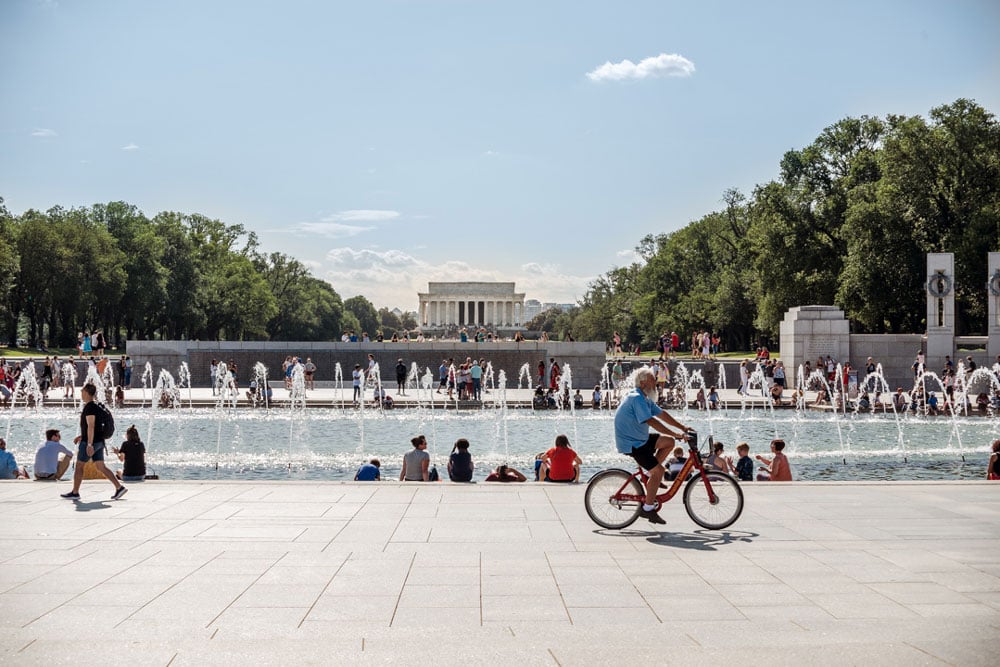 lincoln memorial and memorial fountain with man on bike