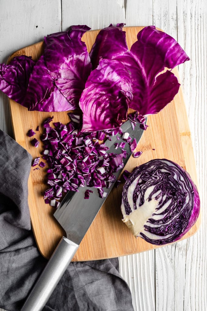 cabbage on cutting board with knife