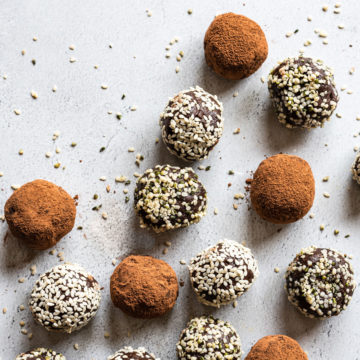 bliss balls coated in cocoa powder and seeds