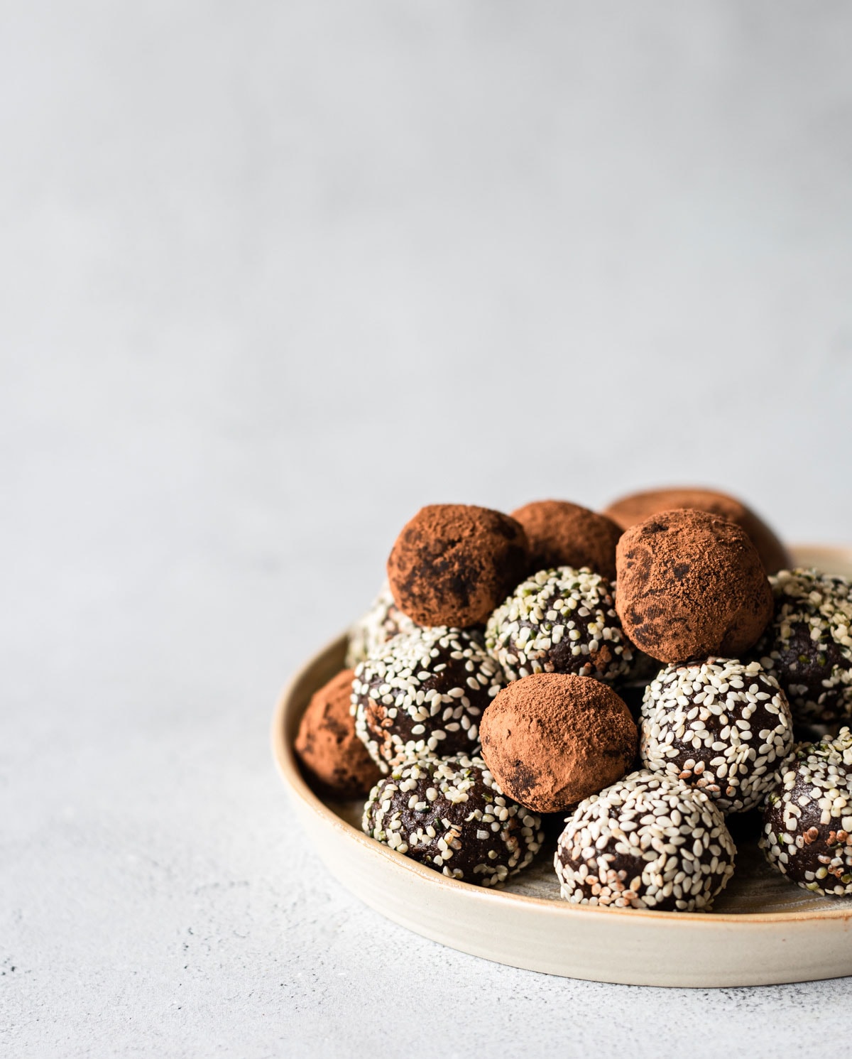 chocolate tahini bliss balls on plate