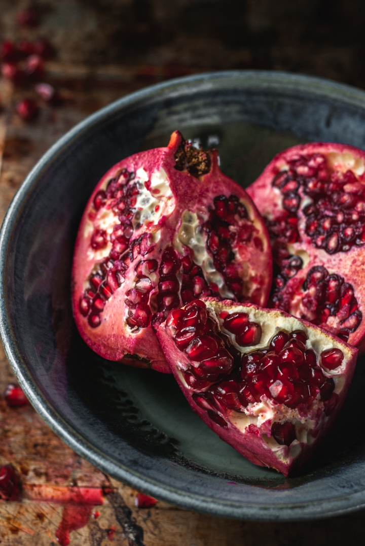 pomegranate sections in a bowl